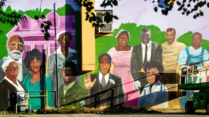 Located at 111 S. Merritt Mill Road, artist Kiara Sanders' new mural features 12 Black trailblazers.