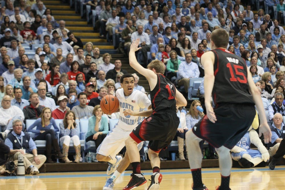 	<p>Marcus Paige drives the lane against NC State&#8217;s Tyler Lewis.</p>