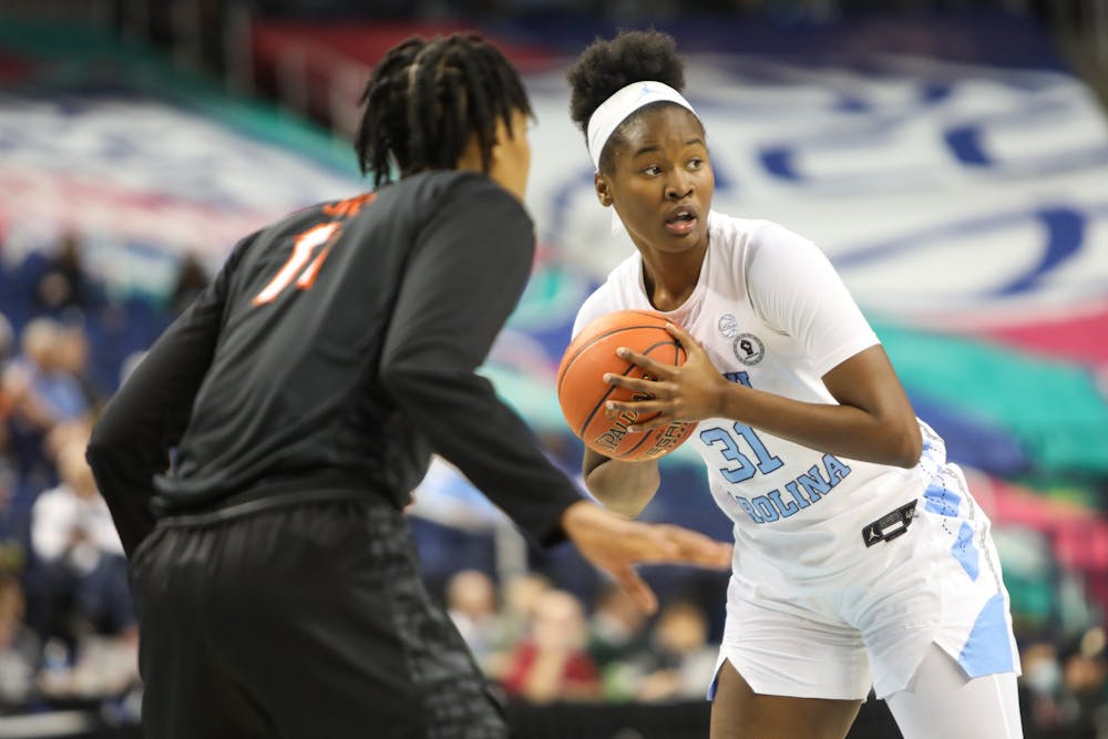 UNC sophomore forward Anya Poole (31) looks for an open pass during the quarterfinals of the ACC Women's Basketball Tournament against Virginia Tech at the Greensboro Coliseum. Virginia Tech won 87-80 in overtime.