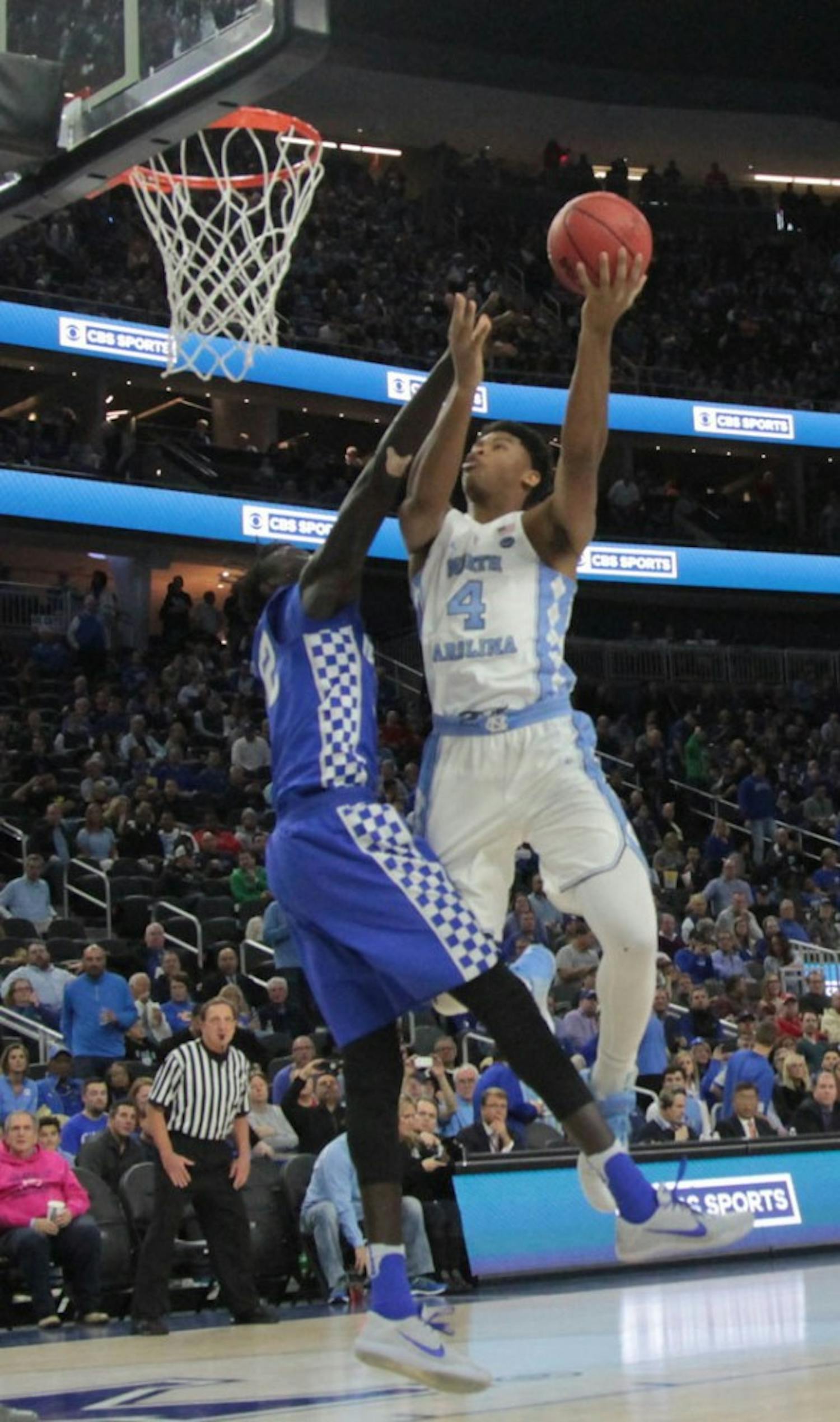 UNC forward Isaiah Hicks (4) goes up for a contested layup against Kentucky at the CBS Sports Classic on Saturday.