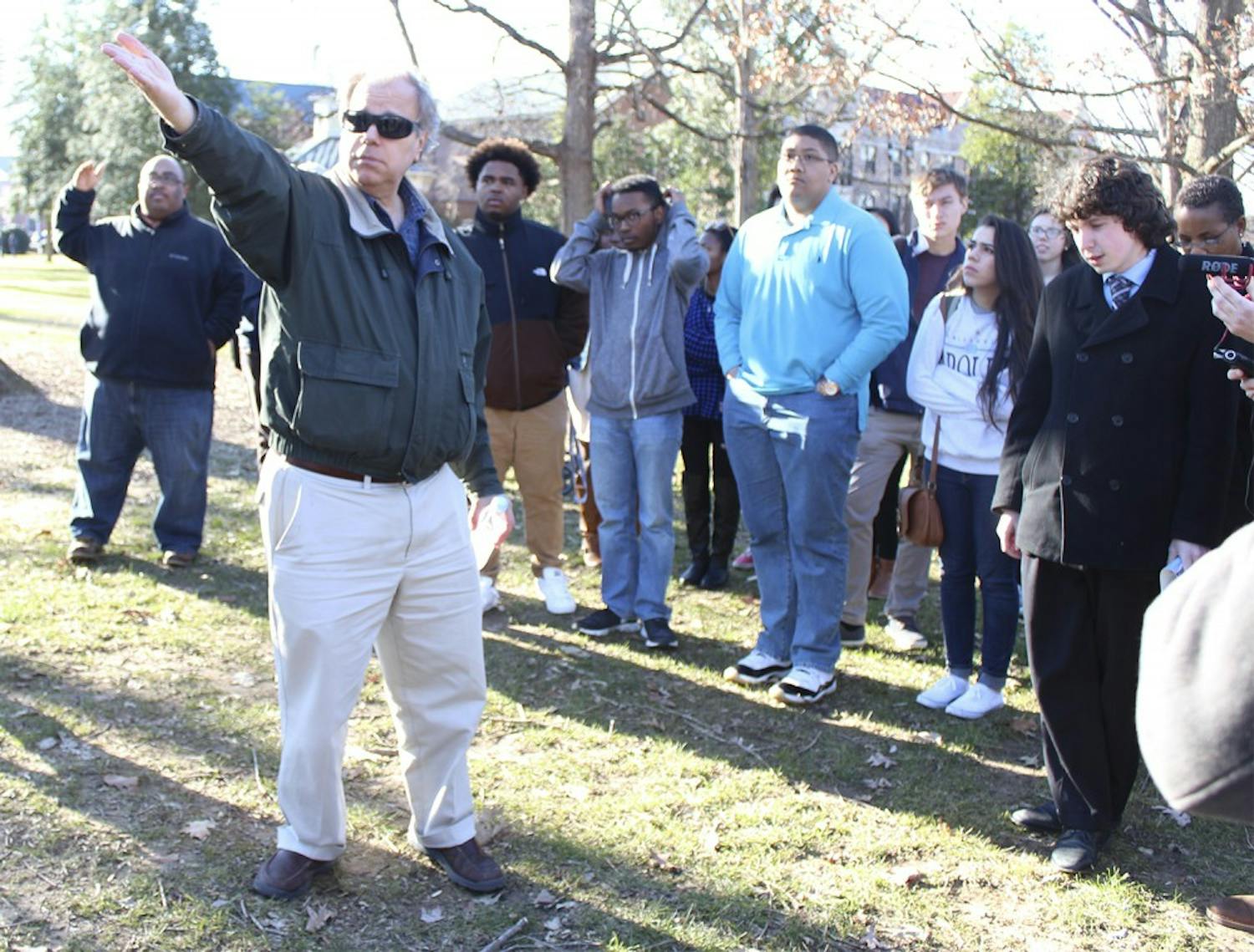 Lecturer in African American studies Frank Porter gives a tour of the African American history of UNC on Friday afternoon. 