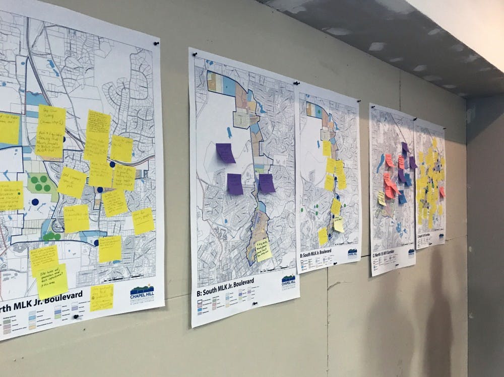 <p>Community-drawn maps are hung up at the first show-and-tell for updating the Future Land Use Map of Chapel Hill</p>