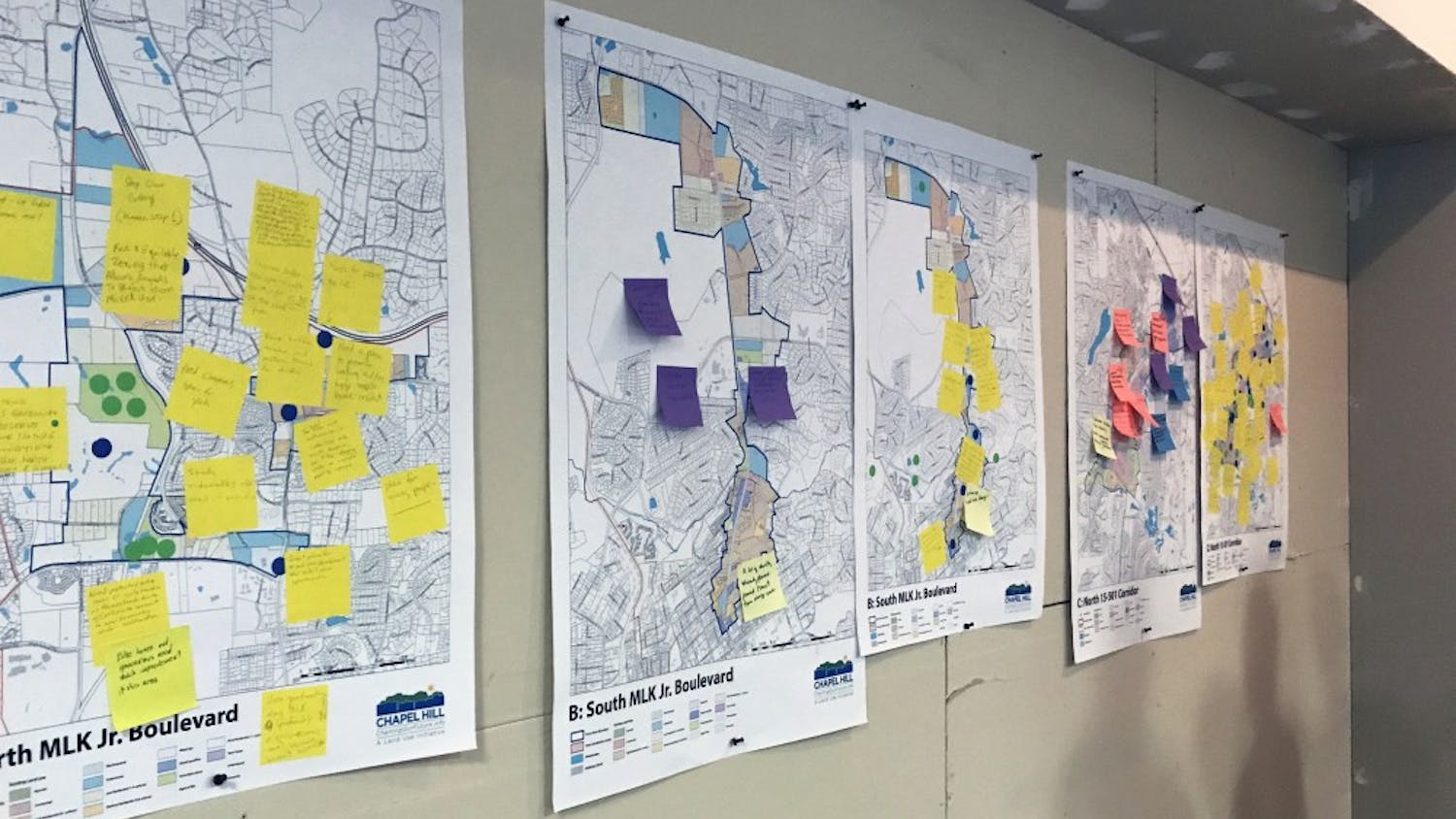 Community-drawn maps are hung up at the first show-and-tell for updating the Future Land Use Map of Chapel Hill