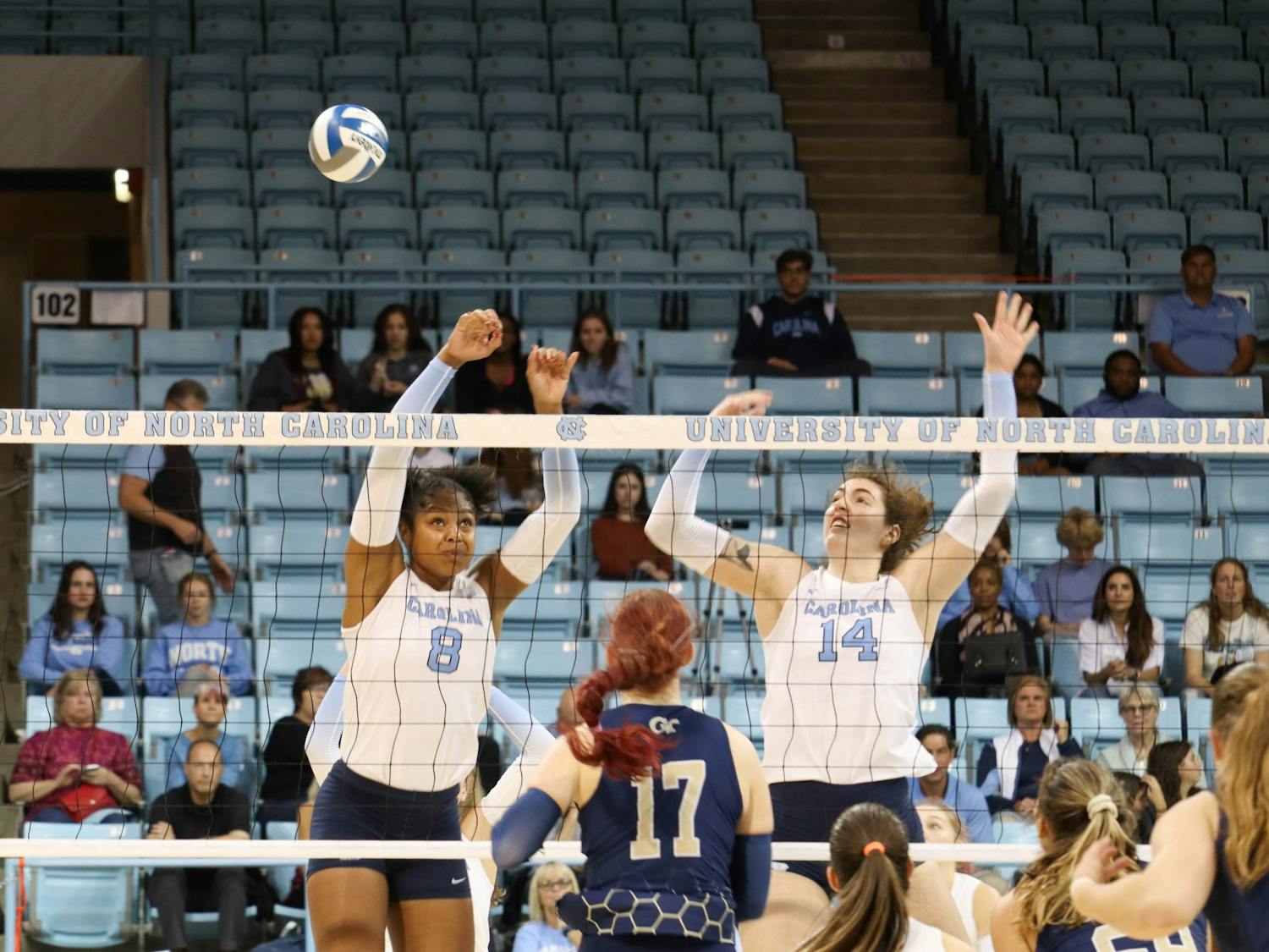 UNC senior middle hitter Skyy Howard (8) and junior middle hitter Kaya Merkler (14) block the ball during the volleyball match against Georgia Tech on Friday, Oct. 28, 2022 at Carmichael Arena. UNC lost 3-1.