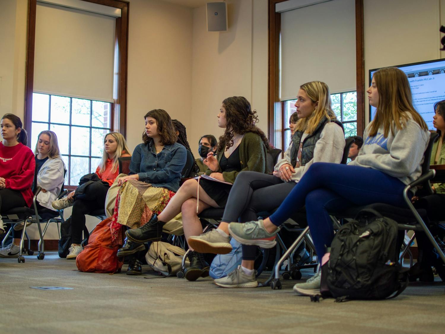 UNC Hussman students listen during the Martin Luther King Jr. Day walk-out/sit-out on Tuesday, Jan. 17, 2023.