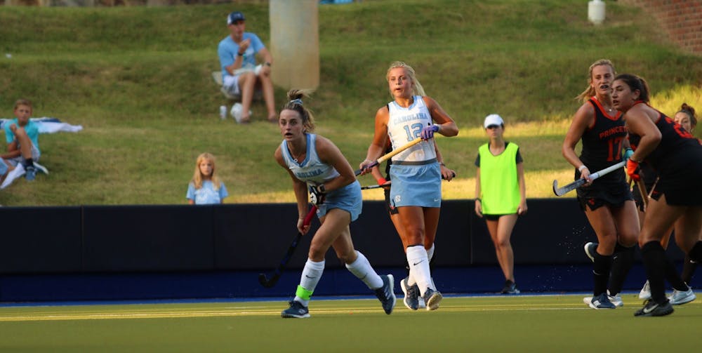 Fifth-year senior forward Erin Matson (1) and first-year forward Ryleigh Heck (12) look towards the Princeton goal. UNC beat Princeton at home 4-3 on Friday, Sept. 2, 2022.