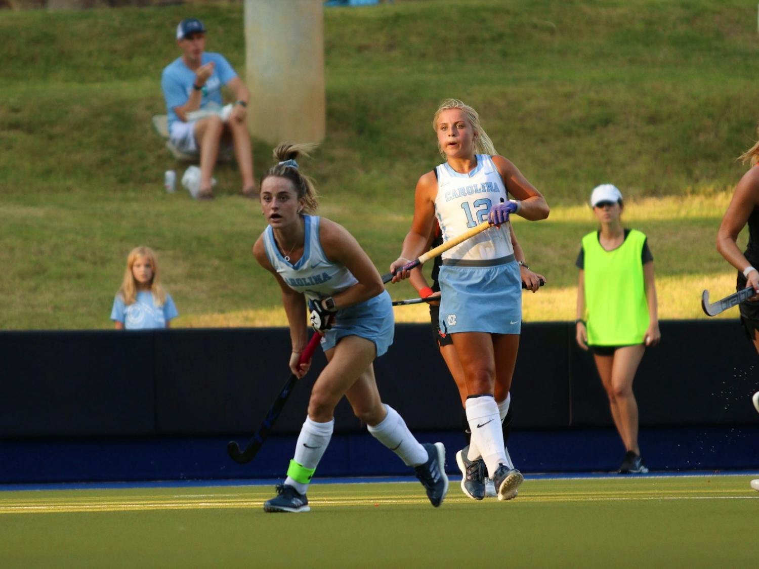 Fifth-year senior forward Erin Matson (1) and first-year forward Ryleigh Heck (12) look towards the Princeton goal. UNC beat Princeton at home 4-3 on Friday, Sept. 2, 2022.