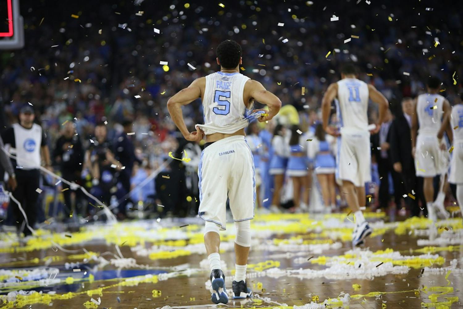 Former UNC seniors Marcus Paige (5) and Brice Johnson (11) walk off the court after falling to Villanova 67-64 in the NCAA National Championship game on April 4.
