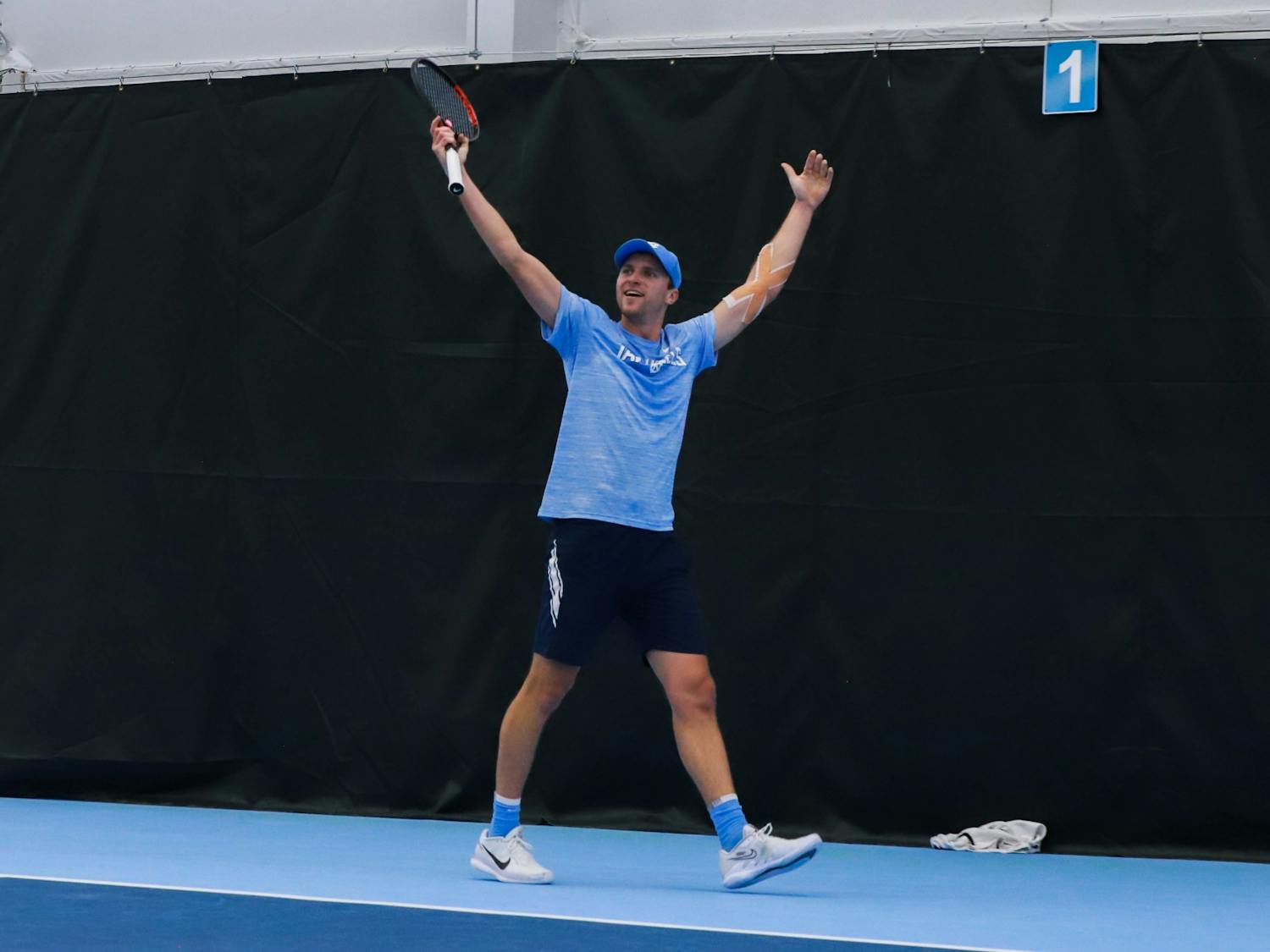 UNC graduate men's tennis player Brian Cernoch celebrates a point against Harvard on Sunday, January 29, 2023, at the Cone-Kenfield Tennis Center. UNC beat Harvard 4-1, winning the team a ticket to Chicago.