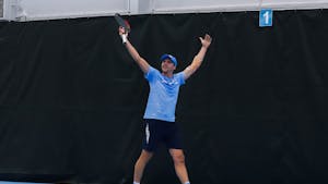 UNC graduate Brian Cernoch celebrates a point against Harvard on Sunday, January 29, 2023, at the Cone-Kenfield Tennis Center. UNC beat Harvard 4-1, winning them a ticket to Chicago.