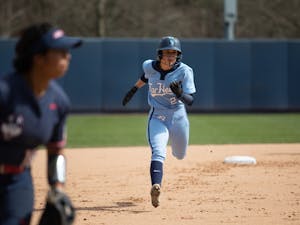 UNC outfielder and junior Bri Stubbs (27) runs to 3rd base during UNC's game against the University of Connecticut on Sunday, March 6, 2022. UNC won that meeting 8-7 as part of the Carolina Classic softball tournament.