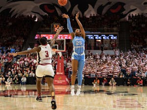 UNC junior guard Deja Kelly (25) shoots a three pointer during the women’s basketball game against NC State on Thursday, Feb. 16, 2023, at Reynolds Coliseum in Raleigh, NC. UNC fell to N.C. State 66-77.