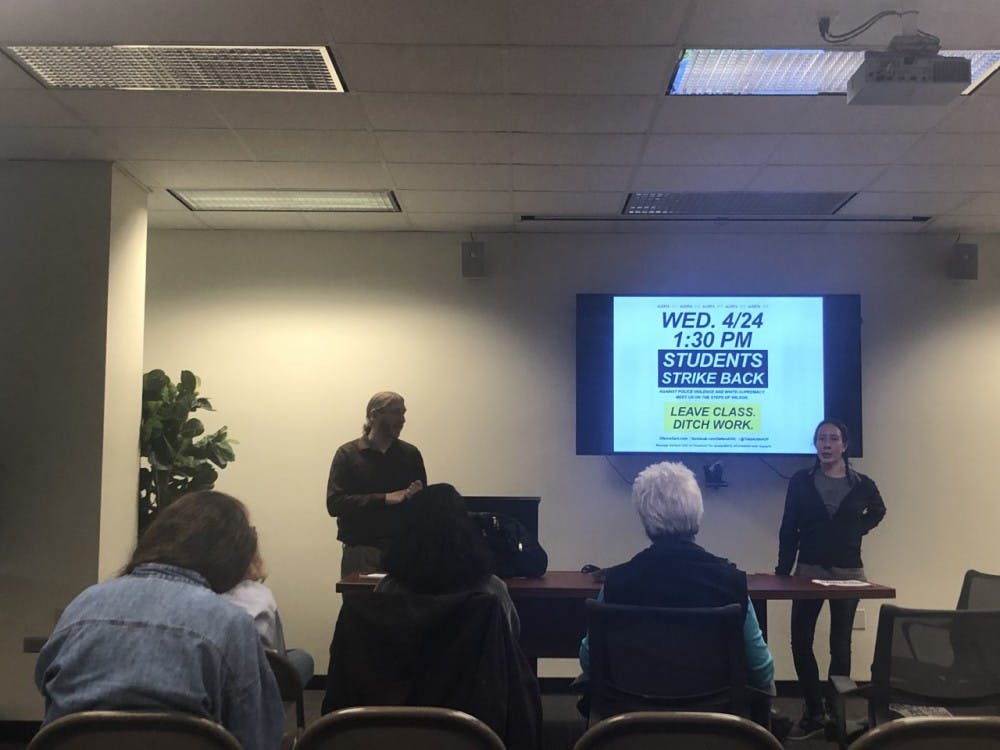 <p>Ayling and Porlides finish their presentation by telling attendees about their demonstration against police brutality on Wednesday.</p>