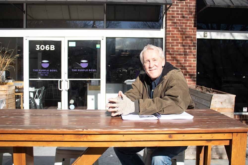 <p>American Civil War lecturer Fred Kiger sits outside of The Purple Bowl on Franklin Street on Wednesday, Jan. 25, 2023.</p>