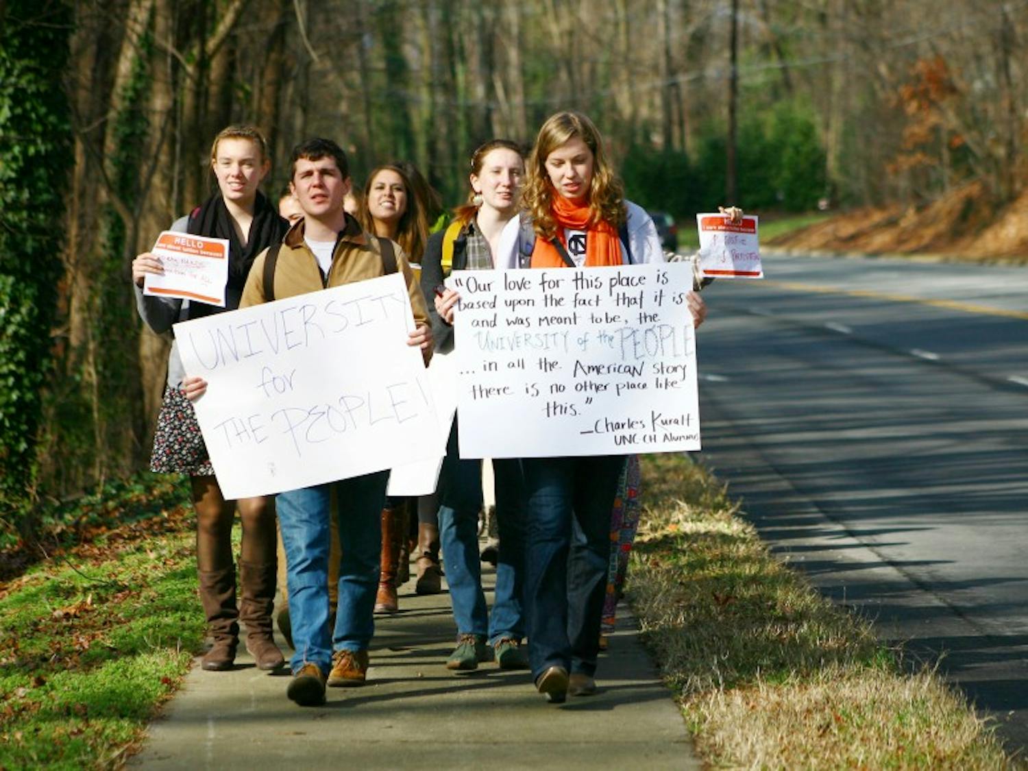 UNC-Chapel Hill students, led by Joseph Terrell (left) and Elizabeth McCain (right), march from the Pit to the Board of Governor's meeting in protest of tuition hikes.  