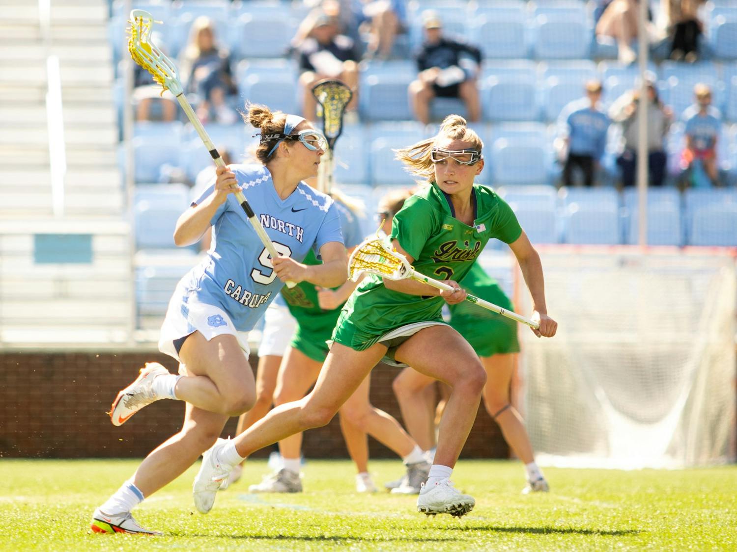 UNC junior midfielder Nicole Humphrey (9) runs the ball down the field during the women's lacrosse game against Notre Dame at Dorrance Field on Saturday, Apr. 2, 2022.