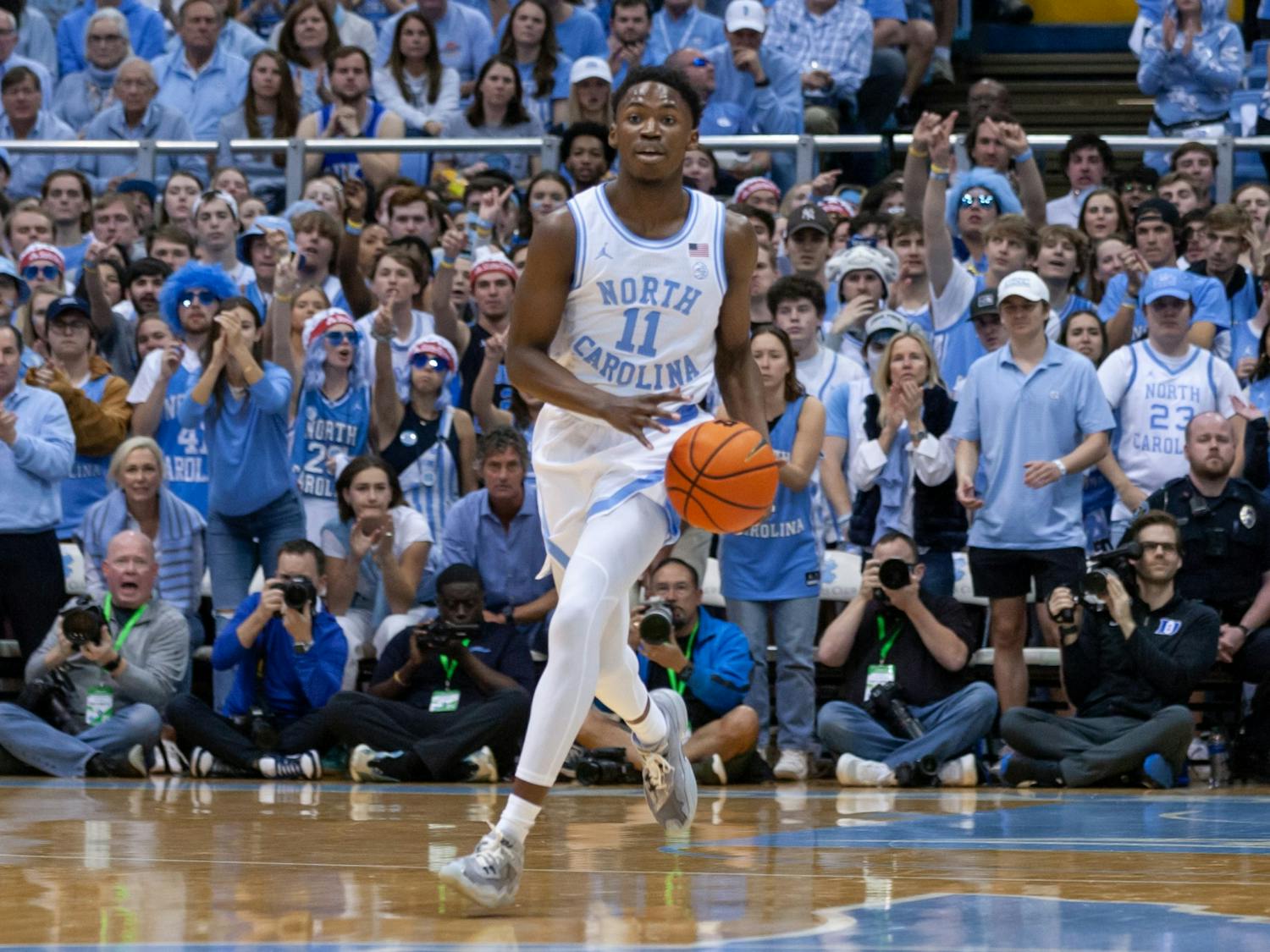 UNC sophomore guard D'Marco Dunn (11) dribbles the ball during the men's basketball game against Duke at the Dean E. Smith Center on Saturday, March 4, 2023. UNC fell to Duke 62-57.