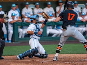 UNC catcher Tomas Frick secures a strike ball during a home baseball game against Virginia Tech on Friday, April 1, 2022.&nbsp;