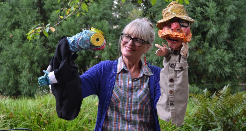 Marianne Gingher, professor of creative writing, with puppets she handmade for her upcoming production "Rumpus in Rome." She says, "It's reached a point were I don't tell them what to do, they tell me; I'm their puppet."