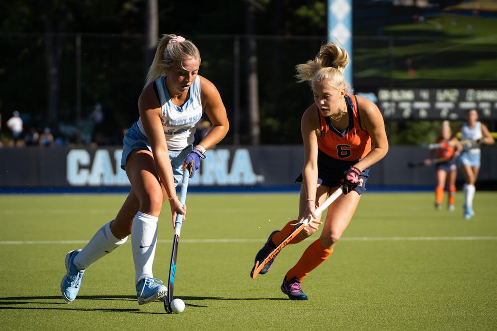 UNC freshman forward Ryleigh Heck (12) handles the ball during the game against Syracuse on Oct. 14, 2022 at Karen Shelton Stadium. UNC beat Syracuse 6-1.