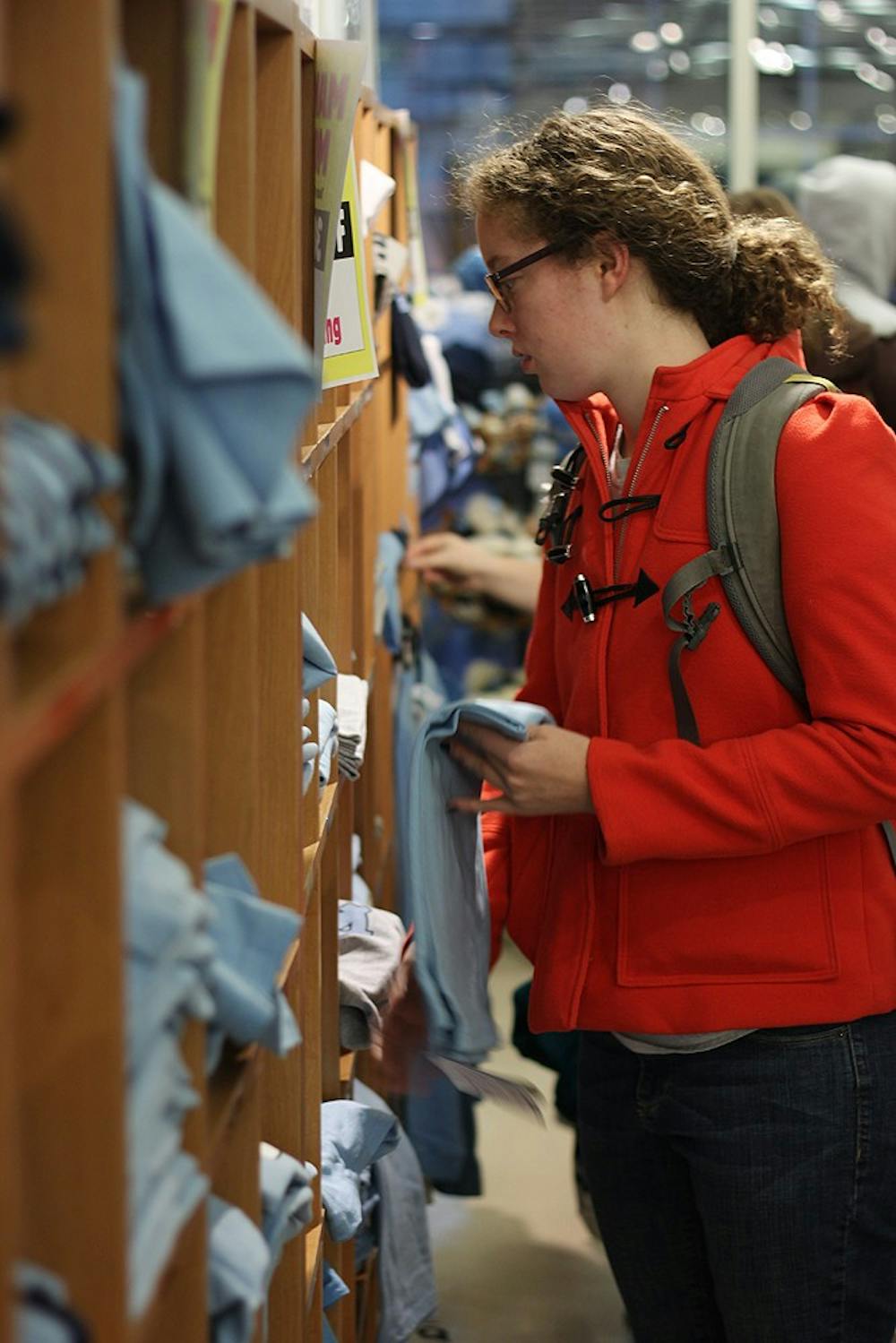 Raleigh McCoy, a sophomore public policy major, shops in Student Stores during Mammoth Monday.