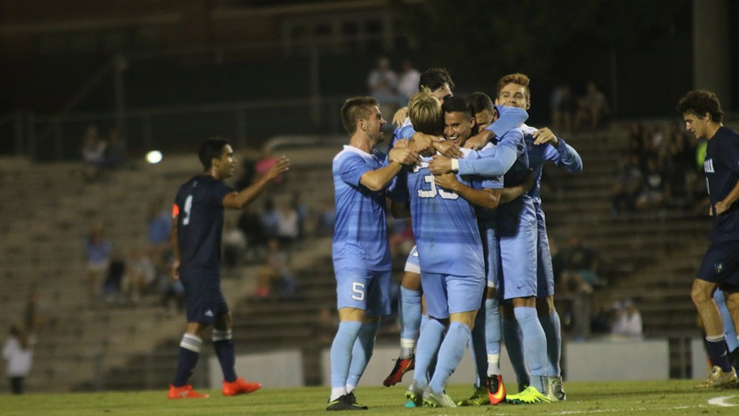 The men's soccer team celebrates after midfielder Nico Melo (31) scored the game winning goal against UNCW on Tuesday night. 