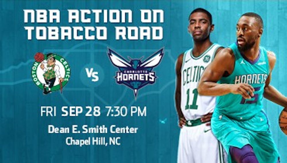 Kemba Walker (15) suits up for the Charlotte Hornets against Kyrie Irving (11) and the Boston Celtics on Sept. 28 in a preseason game at the Smith Center. Photo courtesy of the Charlotte Hornets.