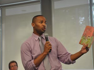 Omar Currie, a former teacher at Efland Cheeks Elementary school, reads from children's book "King and King" at the Chapel Hill Public Library. Currie resigned from the school after a controversy emerged over Currie reading the book, which features a marriage between gay characters, to his third-grade class.