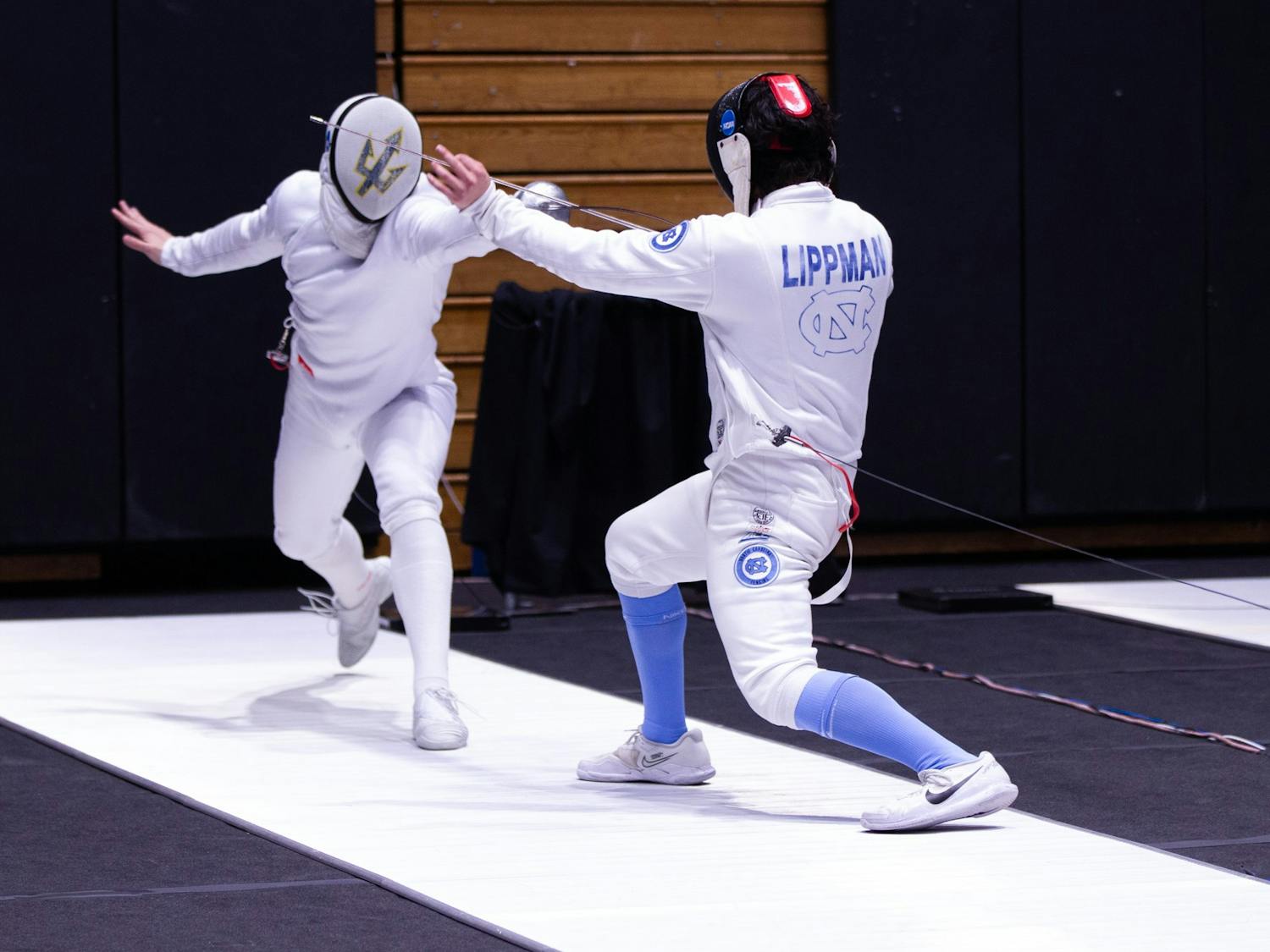 UNC sophomore epee/right hand Eli Lippman fences during the NCAA Fencing Championships at Cameron Indoor Stadium in Durham, N.C. on Friday, March 24, 2023.