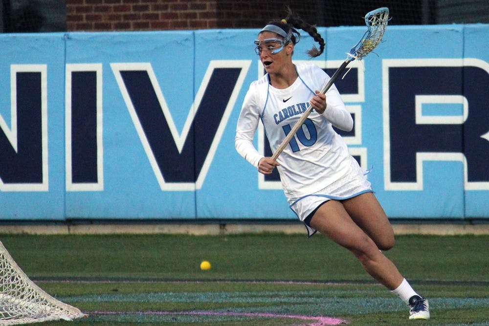 Women's lacrosse suffers a loss 7-6 to Duke in overtime on Wednesday in Kenan Stadium. No. 10 attacker Sydney Holman looks for an opening to score. 