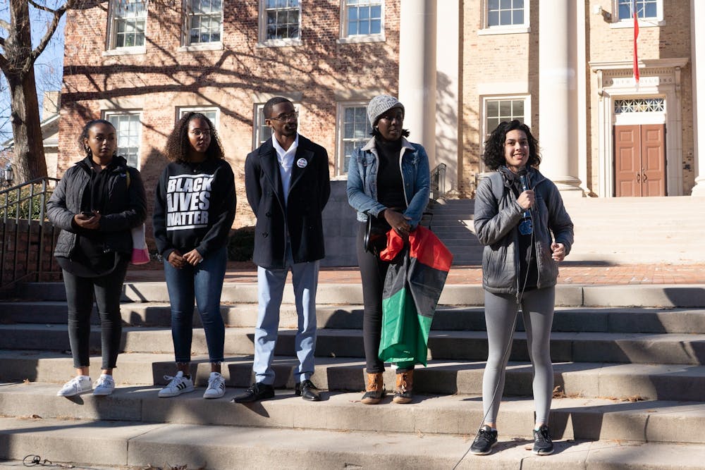 Student Body President Ashton Martin speaks on the steps of South Building on Thursday, Dec. 5, 2019.  The Black Student Movement, Black Congress and local and student activists protested the University giving 2.5 million dollars to the Sons of Confederate Veterans, which were also given Silent Sam, the Confederate monument torn down by activists on the first day of classes in 2018.