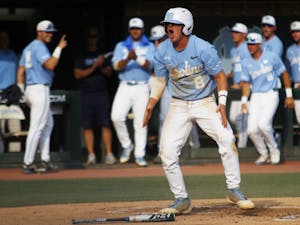 UNC baseball junior and short stop, Ike Freeman (8), celebrates after scoring a run during the final game in the regional championships versus Tennessee on Sunday June 2, 2019. UNC won 5-2. 
