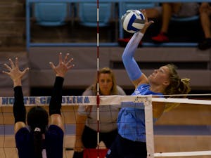 Sophomore outside hitter Mabrey Shaffmaster (9) spikes the ball over the net. UNC beat High Point 3-2 at home on Saturday, Aug. 20, 2022.