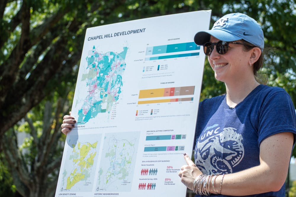 Julia Taylor, urban designer for Neighboring Concepts, tables in the Pit to raise awareness for Chapel Hill Transit's "Shaping Our Future" development initiative on Sept. 15, 2022.