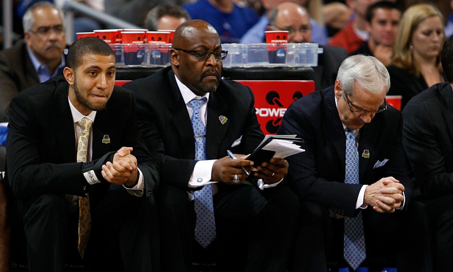UNC guard Kendall Marshall, assistant coach Steve Robinson and head coach Roy Williams watch nervously from the bench as time winds down. The Tar Heels defeated Ohio 73-65 in overtime at the Edward Jones Dome in St. Louis on Friday in the Sweet 16 round of the NCAA Tournament.