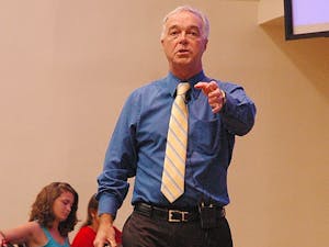 Ken Paulson speaks to an audience of students on 1st Ammendment Day. He spoke about sudent textbooks and citizenship tests that do not include accurate information about the first amendment. He praised journalism in American, and fervently spoke- "Asking people in power tough questions  is a great American tradition." Ken Paulson excites the audience into enthusiasm.