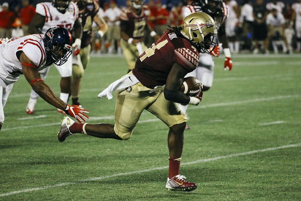 Dalvin Cook (4) rushes the ball at Camping World Stadium in Orlando, Florida on August 5, 2016. The Seminoles topped the Ole Miss Rebels 45-34.