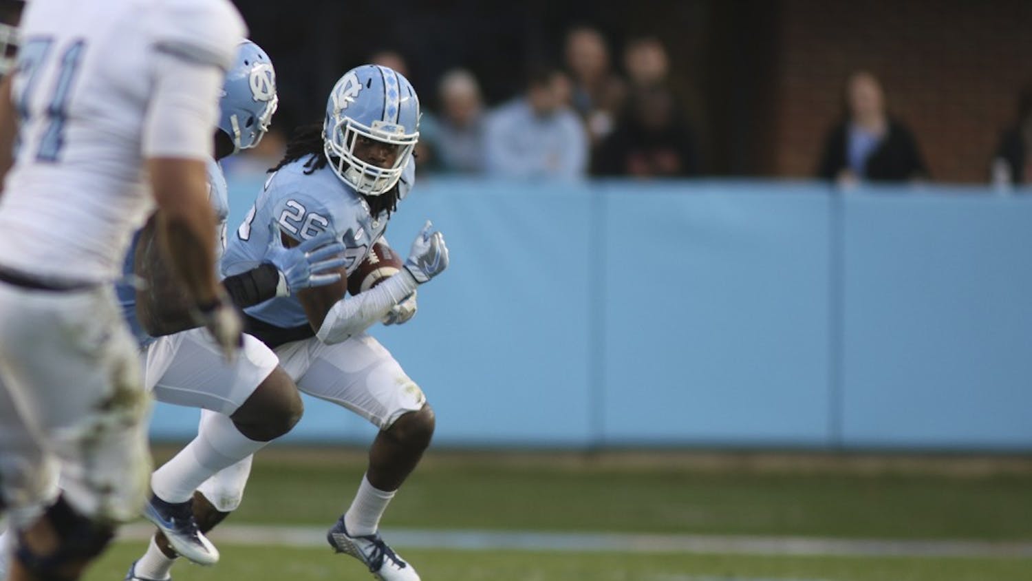 UNC safety Dominquie Green (26) runs back the Tar Heels' first interception of the season for a touchdown.