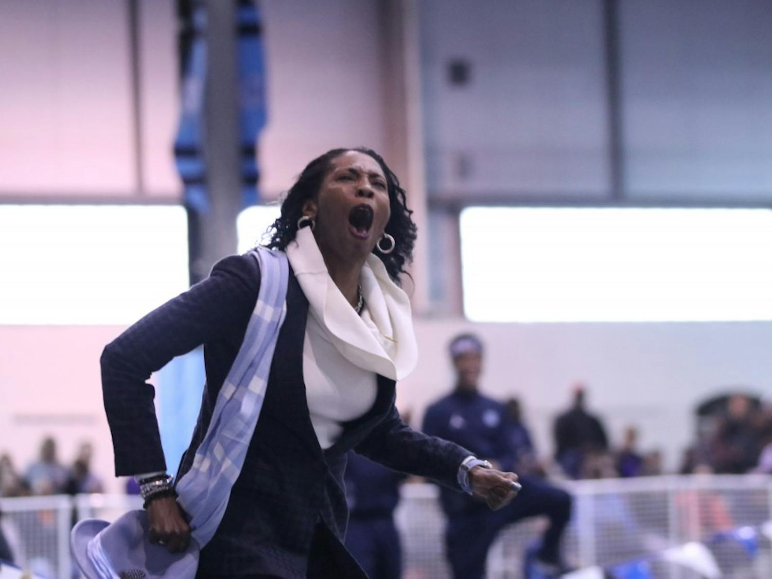 North Carolina track and field assistant coach Nicole Hudson celebrates Nicole Greene's NCAA-best 6-foot-2 high jump. The Tar Heels competed in the Dick Taylor Carolina Cup on Dec. 13 in Eddie Smith Field House.