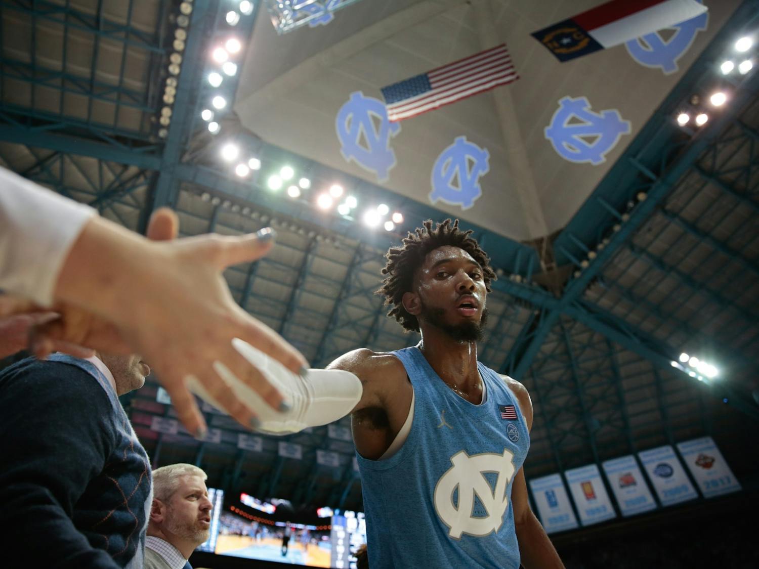UNC sophomore guard Leaky Black high-fives down the bench during a game against Duke in the Smith Center on Saturday, Feb. 8, 2020. The Tar Heels lost to the Blue Devils 98-96.