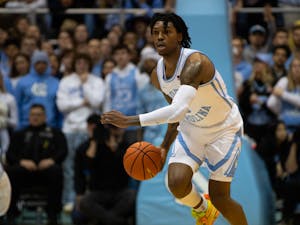 UNC junior guard Caleb Love (2) drives toward the basket in the game against Notre Dame in the Dean Smith Center on Jan. 7, 2023.
