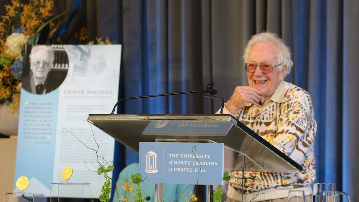 Dr. Smithies, Nobel Prize winner and UNC professor, spoke at a ceremony in Davis library honoring his and Dr. Sancar's achievements, a fellow UNC professor and Nobel Prize winner.