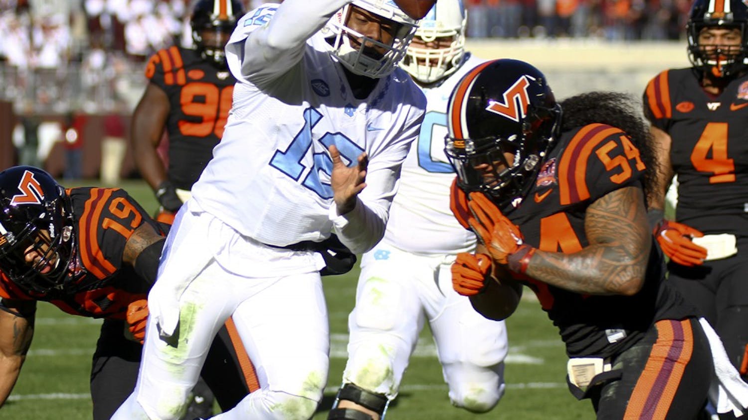 Marquise Williams (12) runs the ball downfield during the game against Virginia-Tech Saturday.