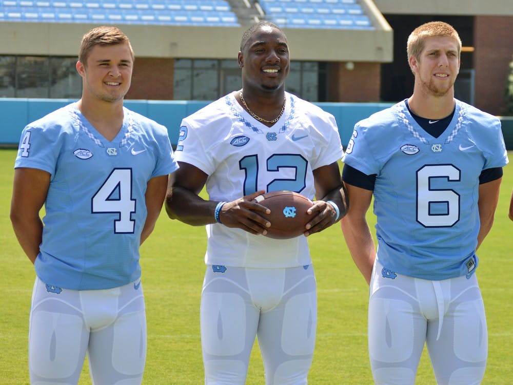 Marquise Williams (12) poses for a photo with fellow teammates at Media Day. 