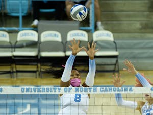 Junior middle blocker Skyy Howard (8) blocks the ball at the volleyball game against  Duke on Oct. 22 at Carmicahel Arena. UNC won 3-0.