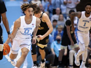 UNC first-year guard Seth Trimble (0) drives towards the basket in the Dean Smith Center on Jan. 4, 2023, against the Wake Forest Deamon Deacons. UNC won 88-79.