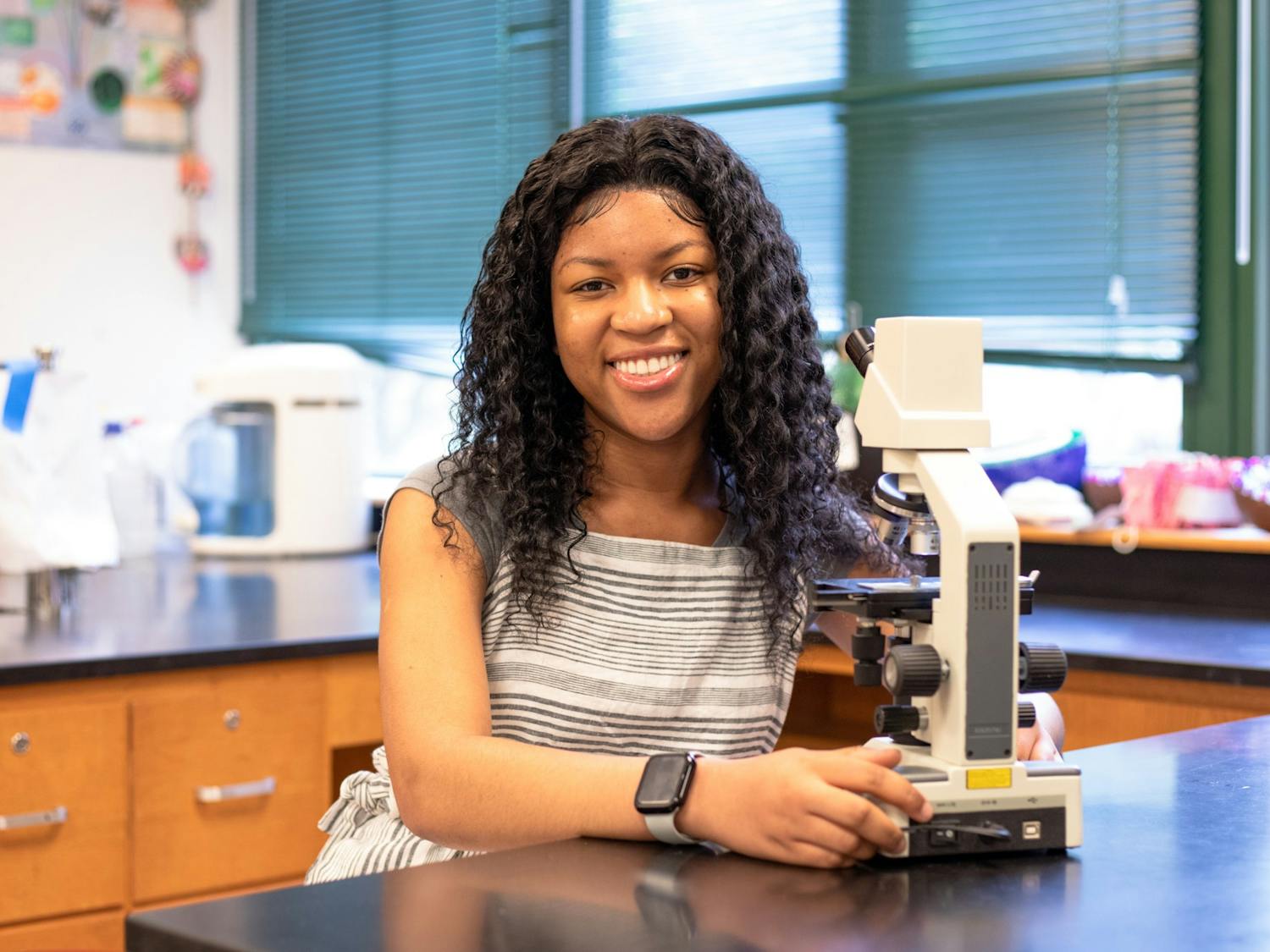 Pristine Onuoha, an 11th-grade student at East Chapel Hill High School, poses for a portrait at East Chapel Hill High School on May 24, 2022. Onuoha is one of five national finalists in the Genes in Space challenge.