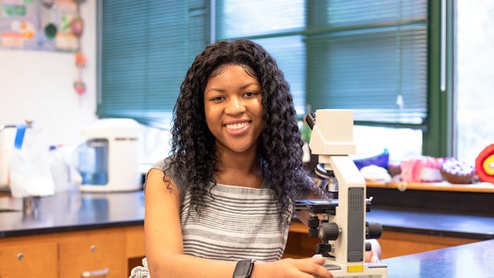 Pristine Onuoha, an 11th-grade student at East Chapel Hill High School, poses for a portrait at East Chapel Hill High School on May 24, 2022. Onuoha is one of five national finalists in the Genes in Space challenge.