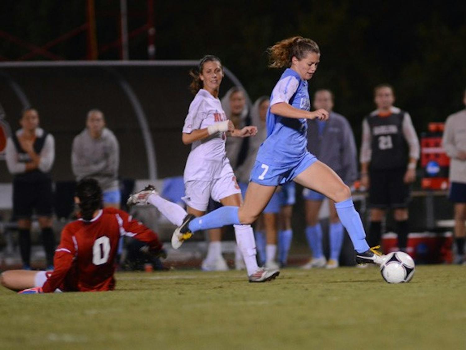 UNC Junior Kealia Ohai (7) gets past the Wolfpack Goalkeeper and scores her second goal of the night. 