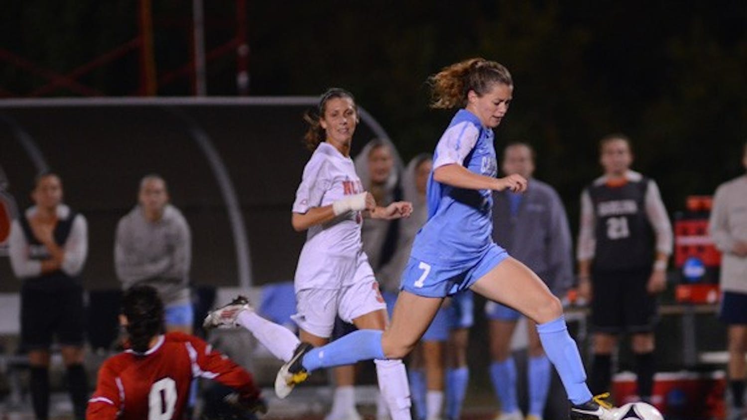 UNC Junior Kealia Ohai (7) gets past the Wolfpack Goalkeeper and scores her second goal of the night. 